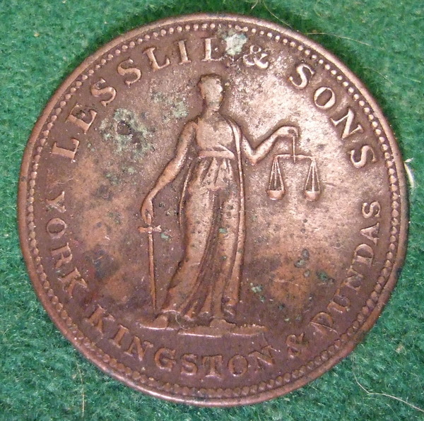 Titre original :    Description Lesslie and Sons business token from 19th Century Ontario Canada. Date 7 March 2009, 02:48 Source CANADA, ONTARIO, YORK KINGSTON and DUNDAS 19th C. LESSLIE and SONS HALFPENNY TOKEN b Author Jerry 